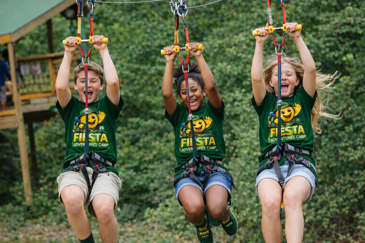 Children zip lining together at Fiesta Adventures Camp