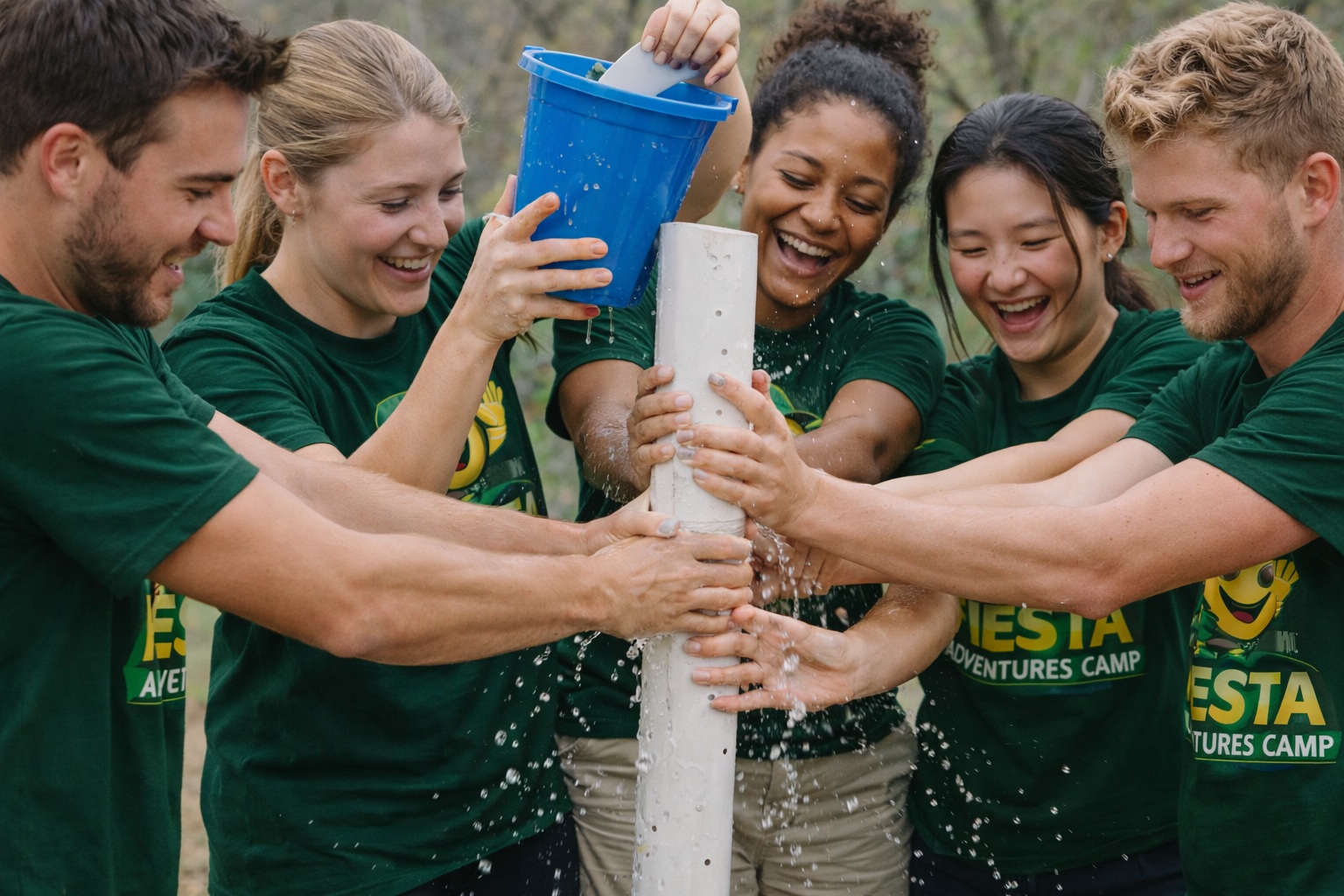 Group activity at Fiesta Adventures Camp with participants wearing branded t-shirts
