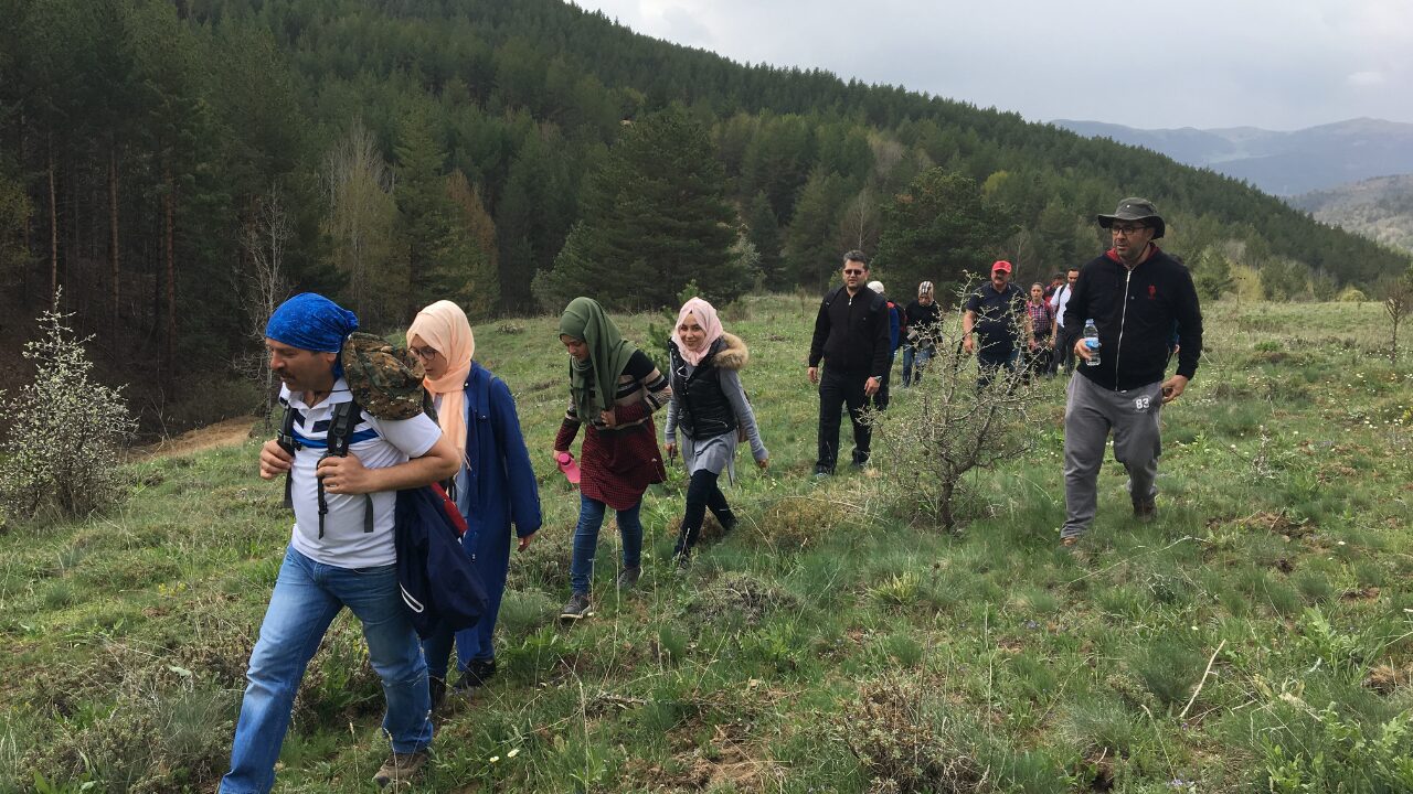 Group hiking through mountain terrain